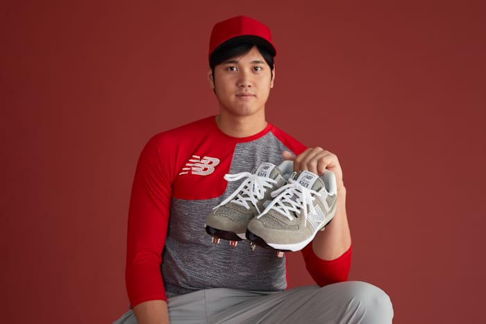 Shohei Ohtani holding cleats.